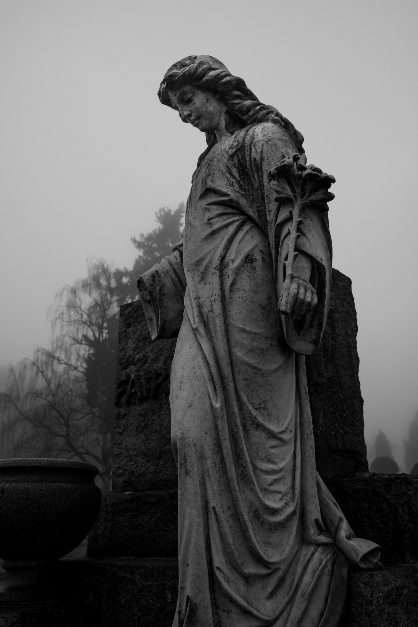 A statue of a sorrowful woman
